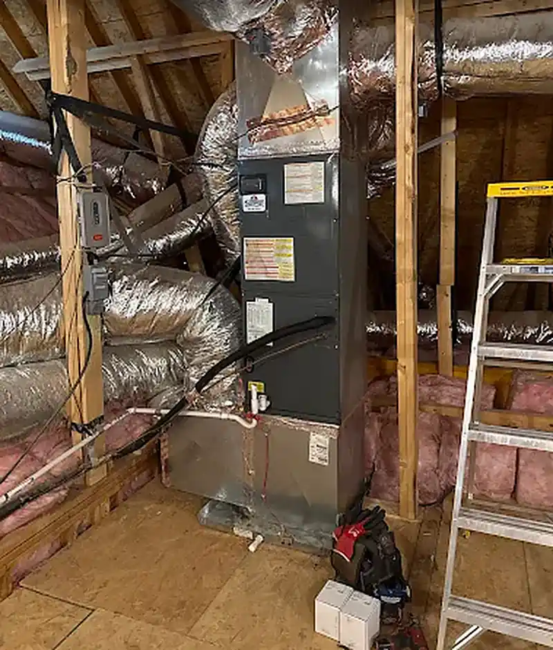 Attic air handler, plenum, and flex ductwork during an installation